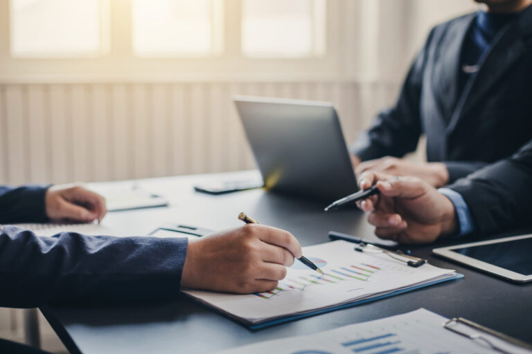 Business meeting about new business investment Presentation of market data graphs and investment planning.