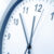 Closeup of hands on clock face